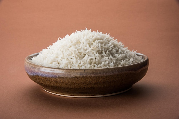 Plain cooked Indian white basmati rice in a ceramic bowl, selective focus