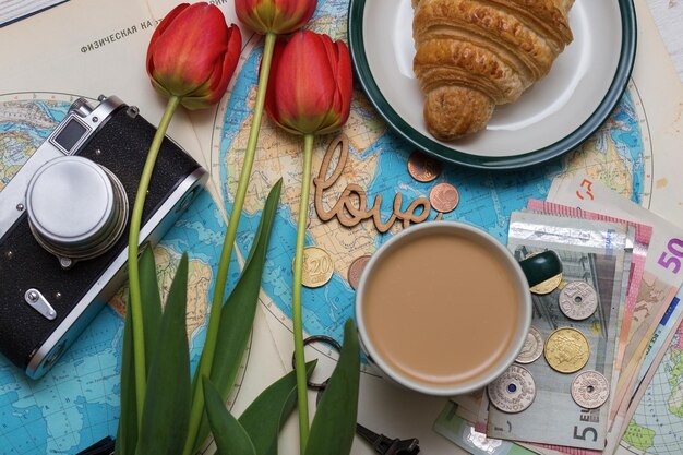 Plan of trip. background - what to take for a trip. map, retro camera, money, coins, croissant, coffee, tulips, love, Eiffel Tower