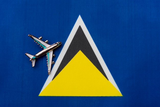 Plane over the flag of Saint Lucia travel concept