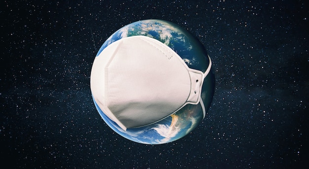 The planet earth is wearing a respirator in the space. Concept of quarantine, protection from viruses and pandemic. Elements of this image furnished by NASA