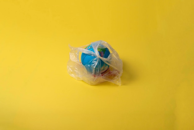 A planet earth in the plastic package ecology pollution garbage