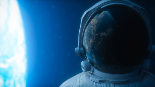 the planet earth reflects in a spacesuit helmet