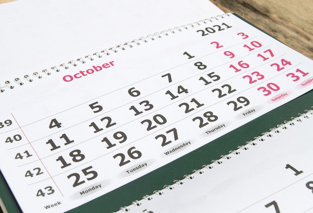 Planning a business calendar for October 2021 paper wall business concept