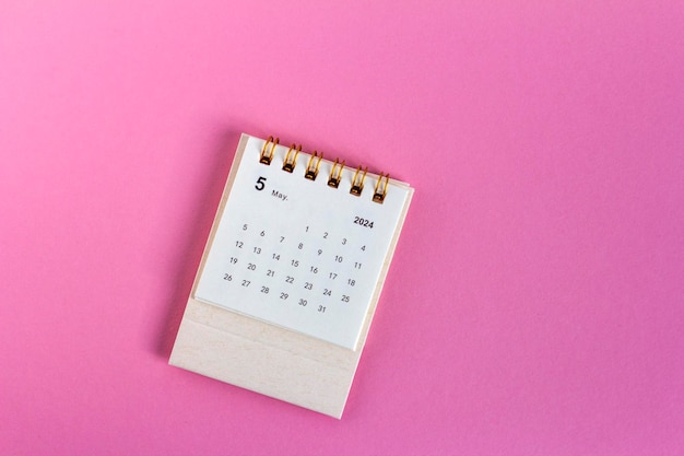 Planning calendar for May 2024 on a pink background