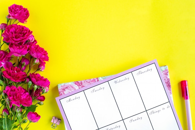 Planning of important things, pink writing instruments on a colored background. things to do. Top view. Copy space.