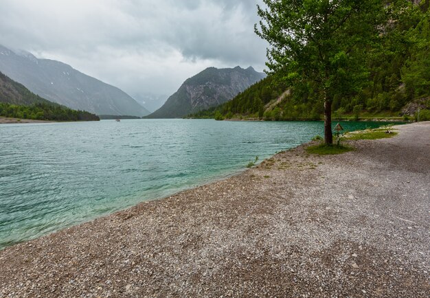 Plansee Alps mountain lake summer overcast day view, Tyrol, Austria.