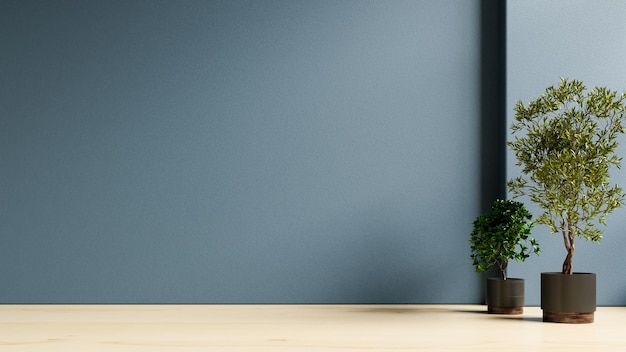 Plants on a wooden floor in empty dark blue room