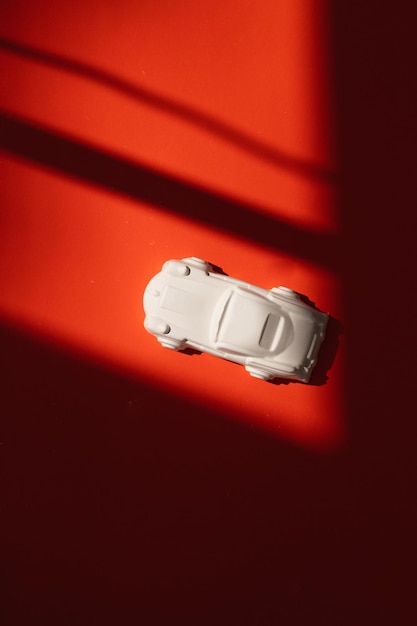 Plaster figure of a car on a colored background