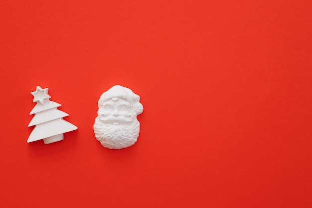 Plaster figure of Christmas tree on a colored background