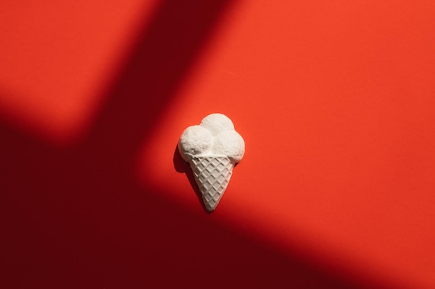 Plaster figure of ice cream on a colored background