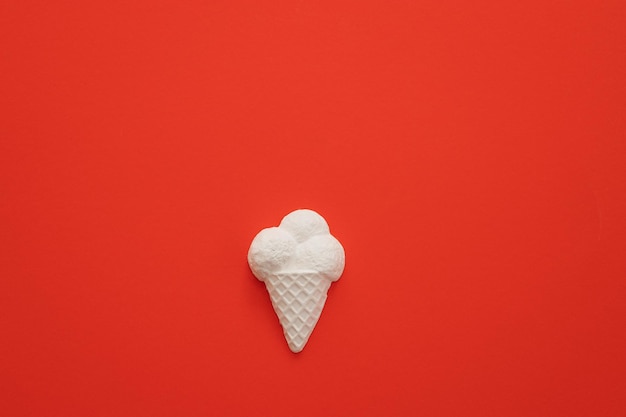 Plaster figure of ice cream on a colored background