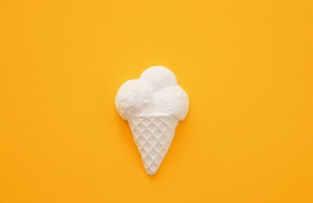 Plaster figure of ice cream on a colored background