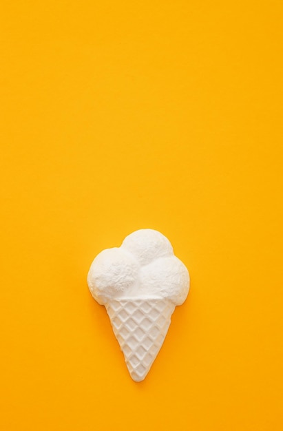 Plaster figure of ice cream on a colored background