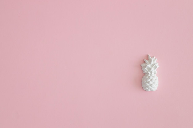 A plaster figure of a pineapple on a colored background