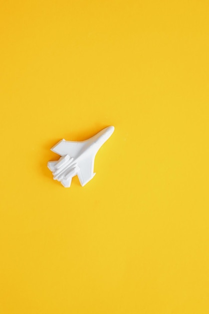 A plaster figure of a plane on a colored background