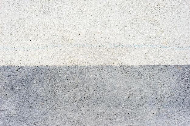 Plastered abstract two colored blue and white wall background