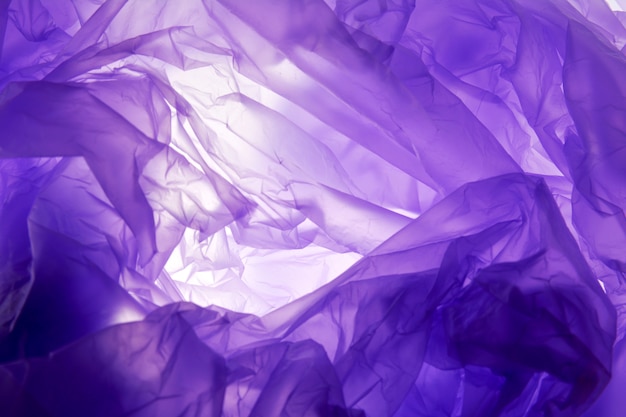 Plastic bag background. Purple texture, grunge style, textured background 