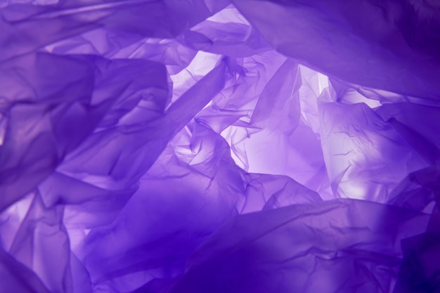 Plastic bag background. Violet texture. Purple background texture.