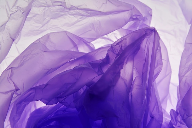 Plastic bag background. Violet texture. 