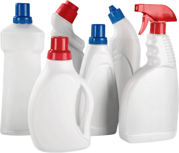 Plastic bottles and cleaning equipment on white background