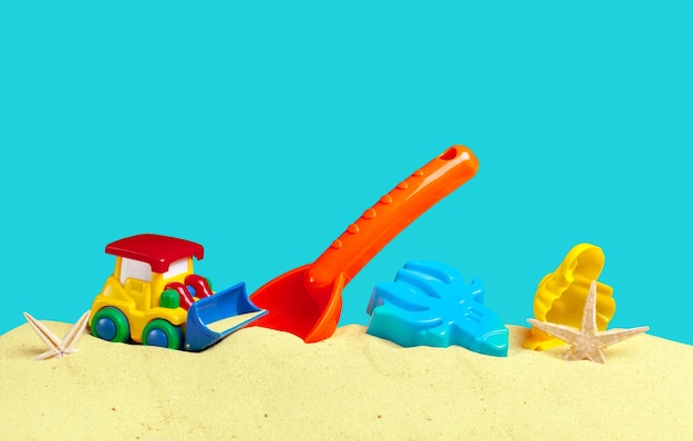 Plastic children toys on the sand beach