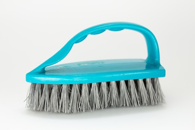 Plastic cleaning brush on a white background