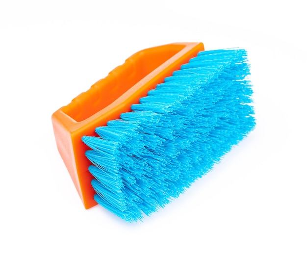 A plastic clothes brush isolated on white background