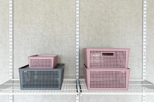 Plastic containers with lids on a metal shelf. Fragment of a metal storage system.