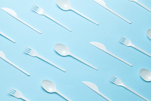 Plastic cutlery forks spoons and knives Pollution of environment with plastic and microplastics