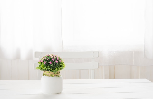 Plastic flower bouquet in a bottle