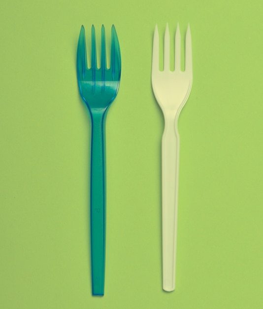 Plastic fork for a picnic on a green.