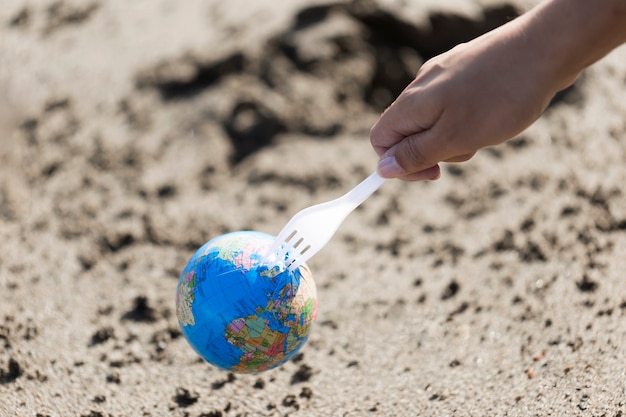 Plastic fork with globe