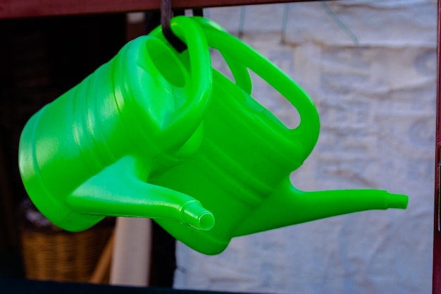 Plastic green watering cans are sold on the street in the Turkish city of Alanya