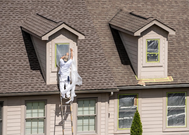 Plastic masking covering applied to windows prior to painting