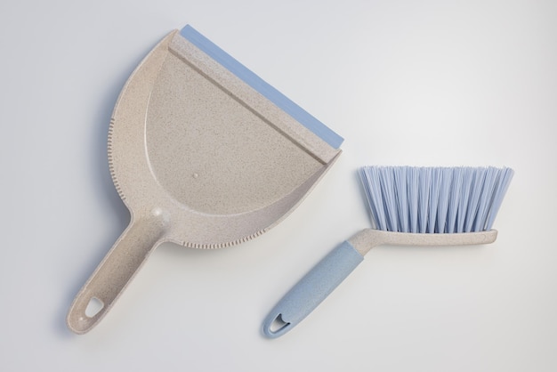 Plastic scoop set dustpan and hand brush on white