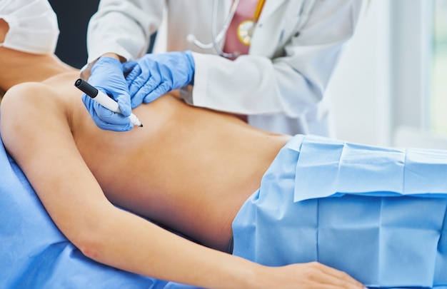 plastic surgeon consulting a female patient