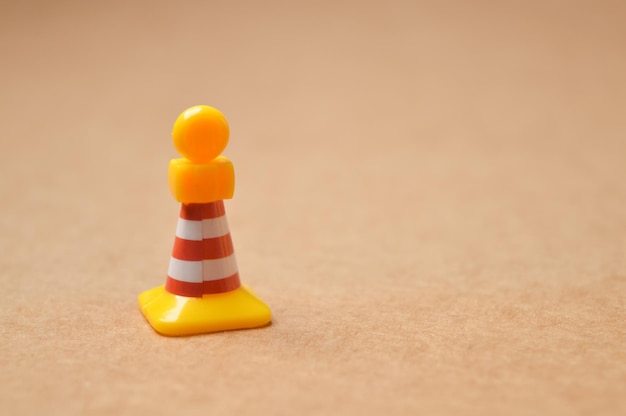 Plastic traffic cone with yellow light Copy space for the text