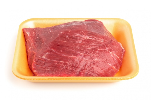 Plastic tray with raw beef  