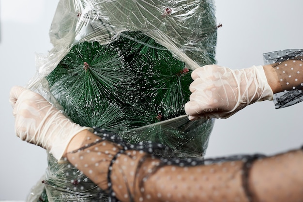 Plastic wrapped Christmas tree.