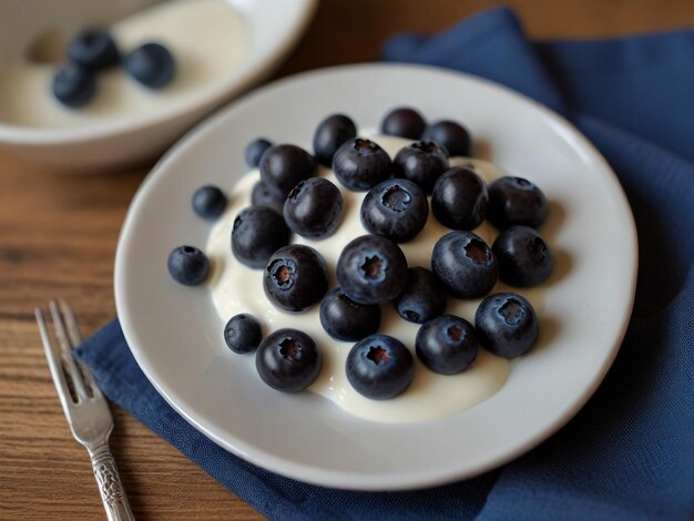 a plate of blueberries with a spoon and a spoon on it