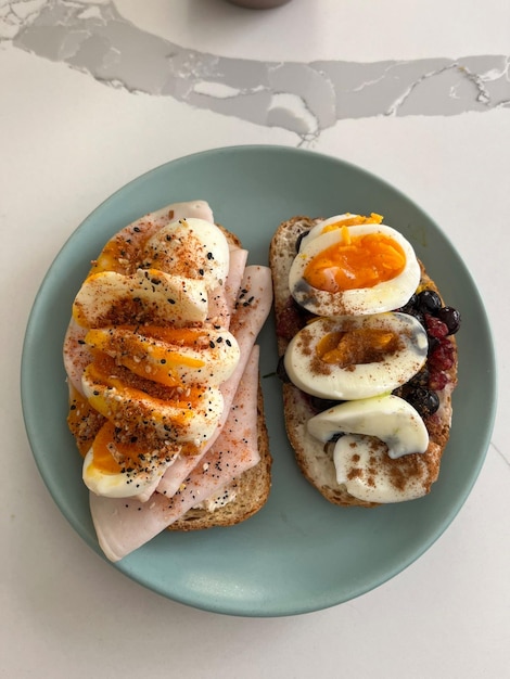 a plate of breakfast food with eggs bacon and eggs