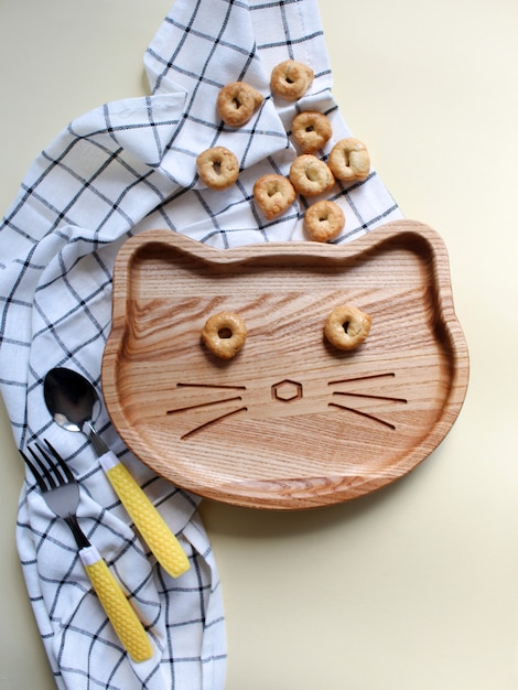 plate for children wooden plate childrens breakfast and snaks Flat lay concept