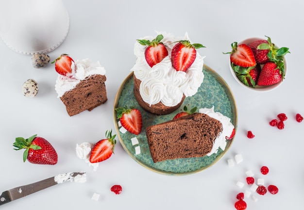 A plate of chocolate cake with strawberries on it