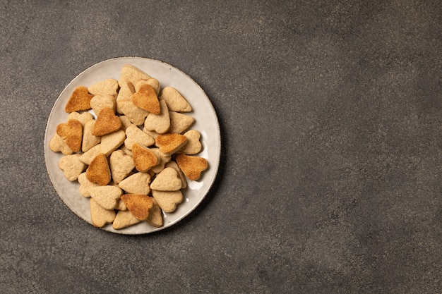 Plate of cookies on dark background