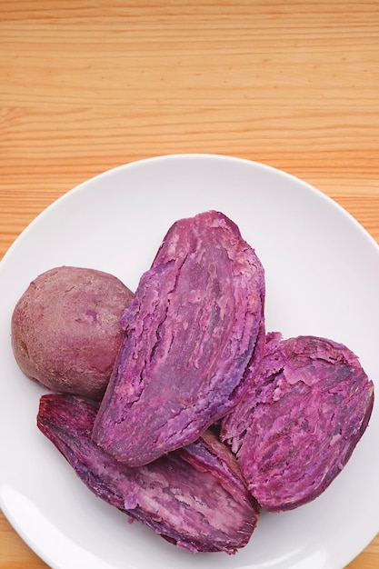 Plate of Delectable Steamed Unpeeled Purple Sweet Potatoes Showing Vivid Color Flesh