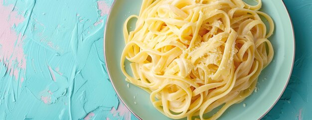 Plate of Fettuccine Alfredo Pasta on Blue Table