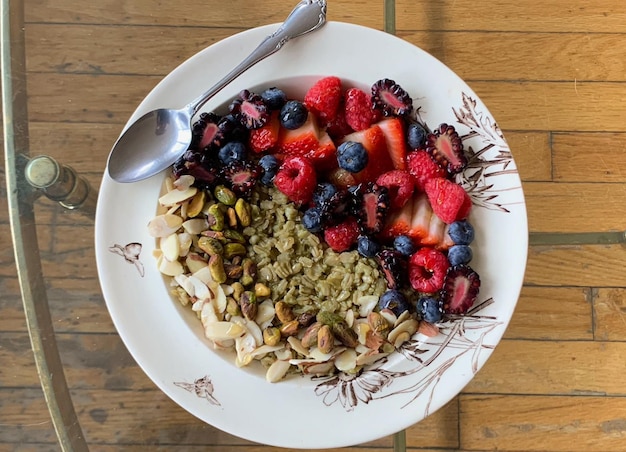 a plate of food with berries and fruit on it