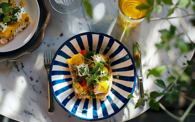 Photo a plate of food with a blue and white striped pattern