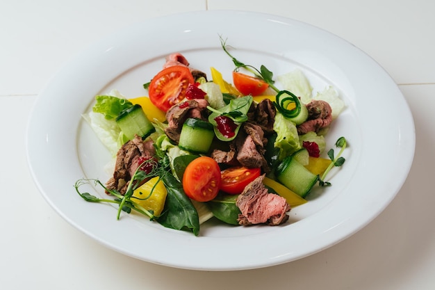 A plate of food with cucumbers and cucumbers