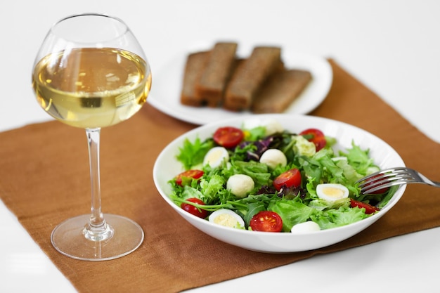 Plate of fresh delicious salad on napkin closeup